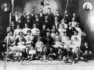 An old photo of a large family group gathered for a golden wedding anniversary in 1912