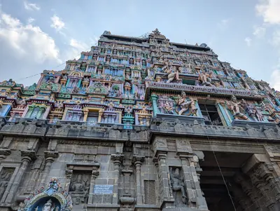 A colourful temple tower covered with painted figures of gods