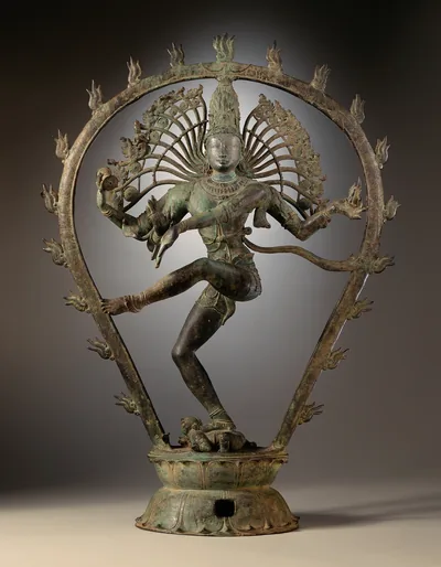 A bronze Nataraja with flying hair inside a flaming arch