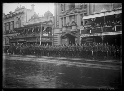 Old photo of soldiers lined up in front of a grand building on Australia Day 1917