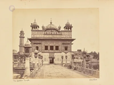 Sepia photograph of the Golden Temple and its causeway with marble railings