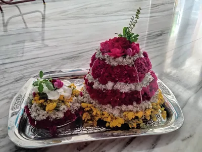 A Saddula Bathukamma, a tall cone of flowers in rings of pink, white and yellow