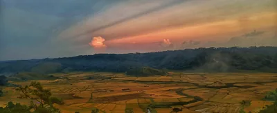 Sunset over the green fields and hills of Jowai in the Jaintia Hills
