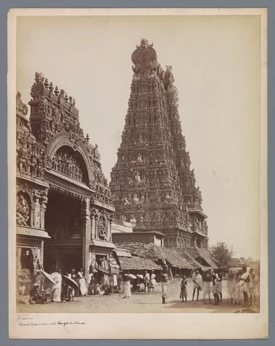 Old photo of a temple gateway and tall tower with a crowd in front