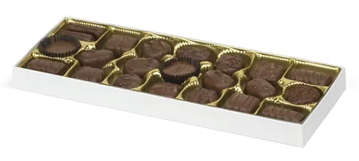 An open box of chocolates in gold paper cups