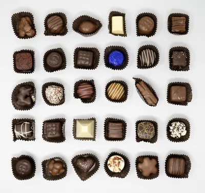 A box of mixed chocolates in neat rows