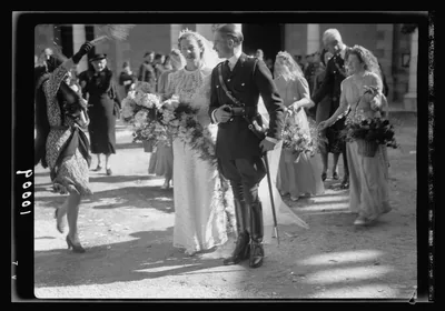 An old photo of a bride and groom leaving a church