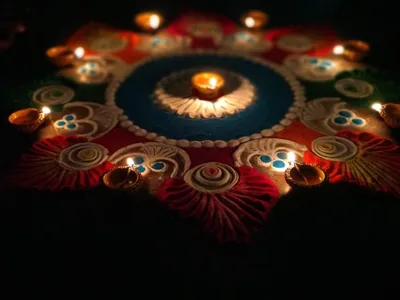Rangoli with lit diyas on Diwali night
