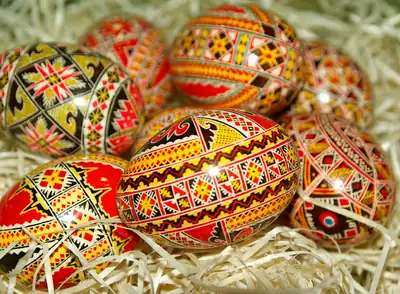 Rows of brightly painted Easter eggs with fine patterns