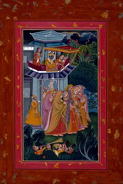 An old Rajasthani painting of the Gangaur festival in rich reds and blues