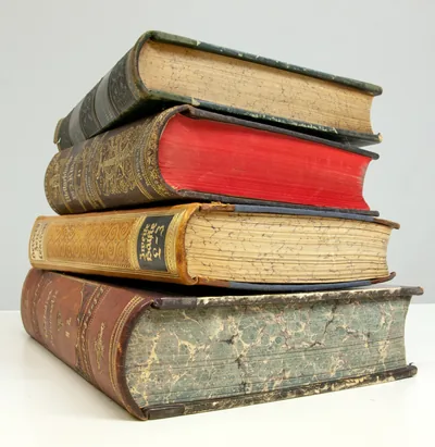 A stack of old leather-bound books