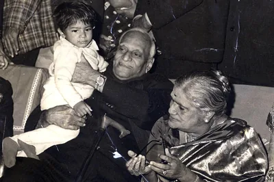 An Indian family with a great-grandfather holding a small child