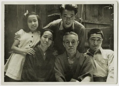 An old photo of Japanese grandparents with their grown sons