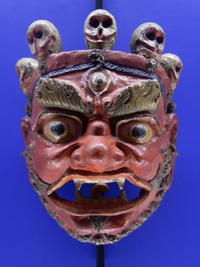 A carved and painted Cham dance mask from a Himalayan monastery
