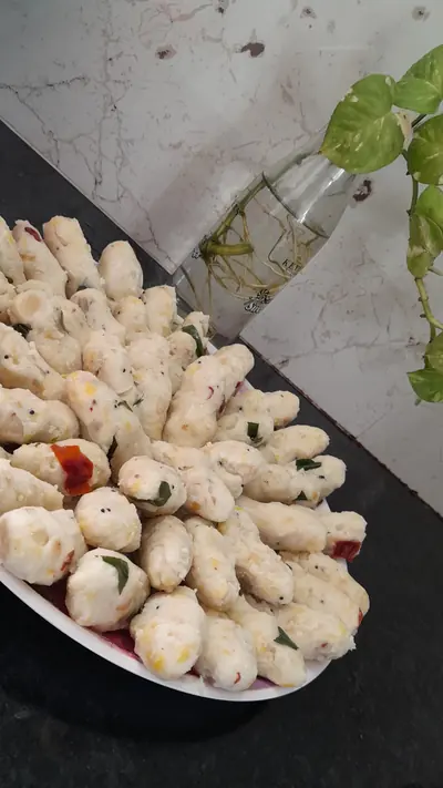 A plate of small white steamed rice dumplings