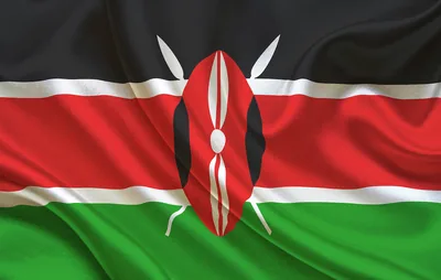 The black, red and green flag of Kenya with its shield and spears