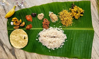 A Kerala meal of rice and many side dishes on a banana leaf
