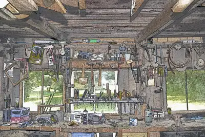 A busy workshop with tools hanging on the walls