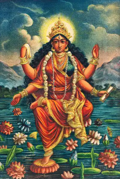 A colourful old print of the goddess seated on a lotus in water, holding lotuses, with garlands