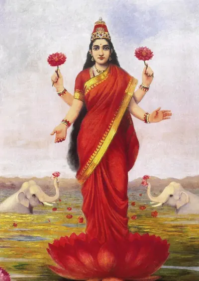 A painting of Goddess Lakshmi in a red sari standing on a lotus, with elephants behind