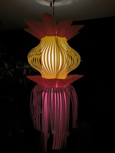 A glowing gold and red lantern against the night