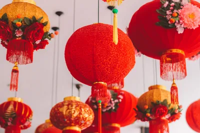 Round red Chinese lanterns with golden tassels hanging close together