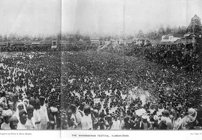 Old photo of a vast crowd gathered around a temple tank