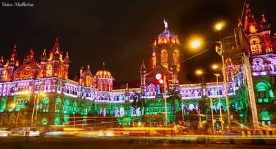 Chhatrapati Shivaji Maharaj Terminus lit in orange, white and green at night