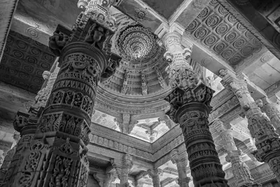 Finely carved white marble pillars and dome inside a Jain temple