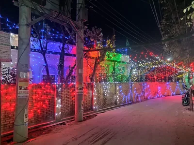 A lane glowing with red, blue and green lights at night