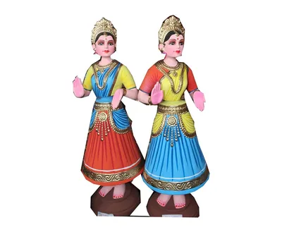 Two painted dancing dolls in bright skirts