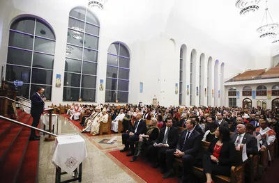 A full church with people seated during a Christmas service