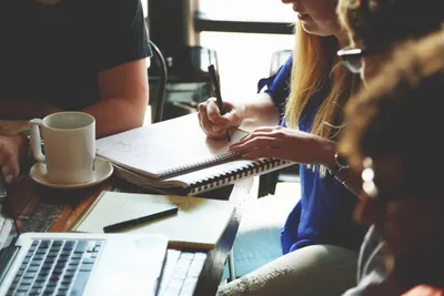 A team working together at a wooden table