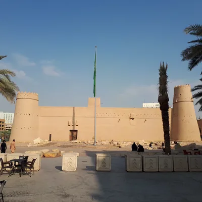 The mud-brick walls and towers of an old fort