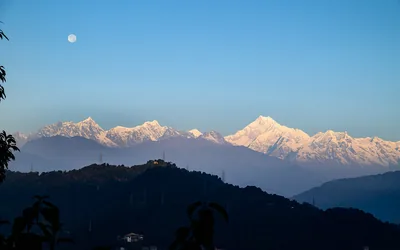 Snow peaks of Kangchenjunga under a clear blue sky