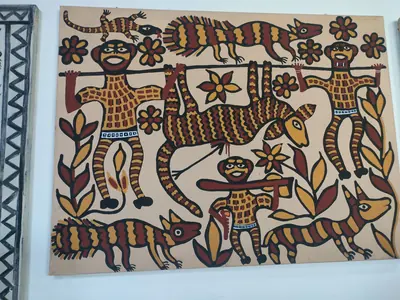 A Sohrai wall painting of animals, birds and flowers in earth colours