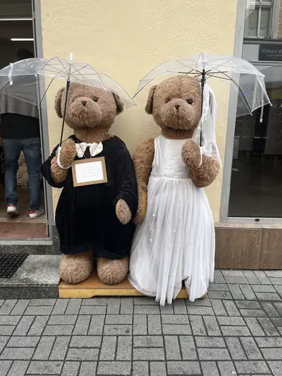 Two life-size teddy bears dressed as a bride and groom