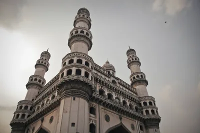 The Charminar with its four tall minarets seen from below