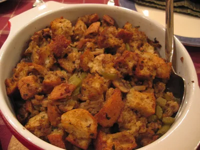 A dish of bread stuffing with herbs and vegetables