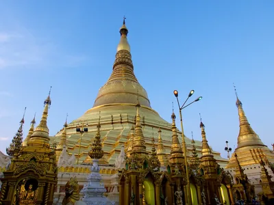 A golden pagoda shining under a blue sky