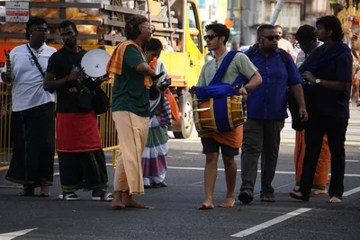 Drummers walking in a street procession