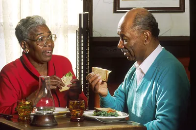 An older couple sharing a meal and talking